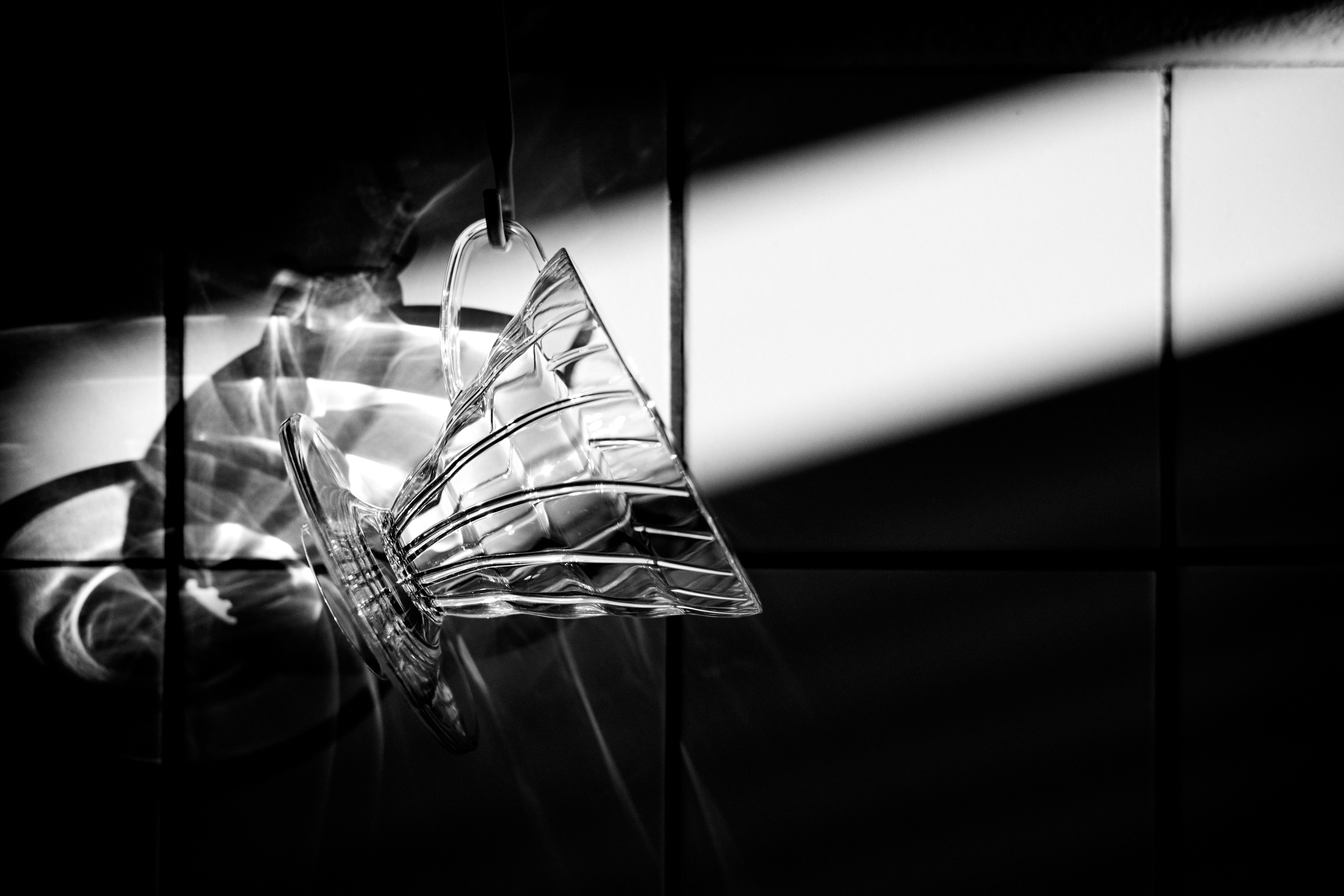 A black and white photo of a light fixture