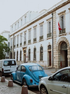 A group of cars parked on the side of a street