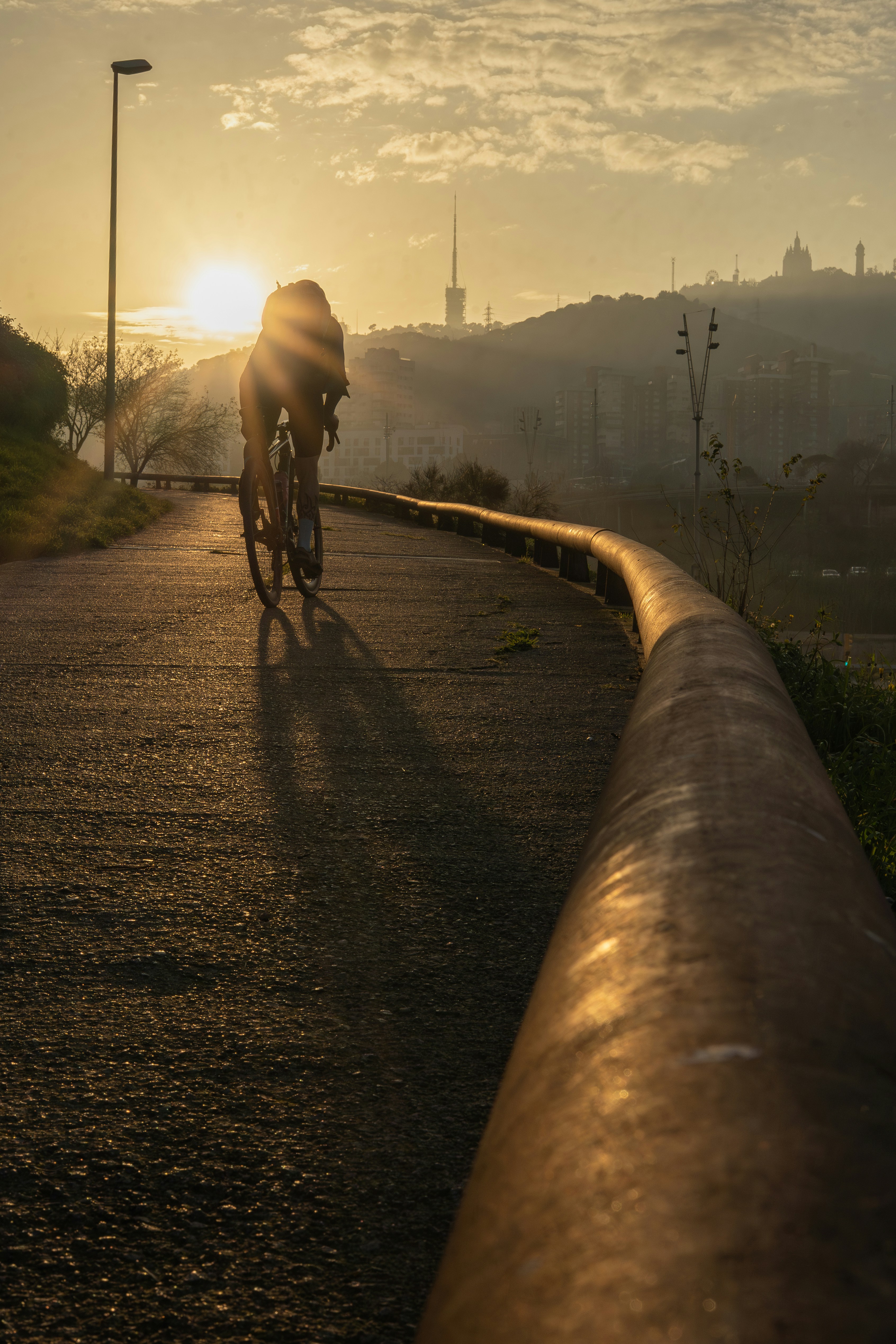 A person riding a bike down a street
