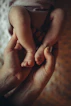 A person holding a baby in their hands