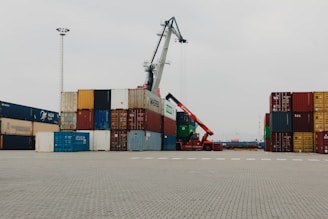 A large crane is in the middle of a parking lot