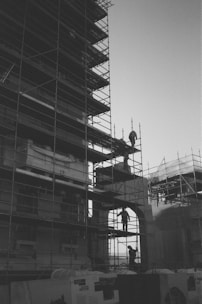 A black and white photo of a building with scaffolding