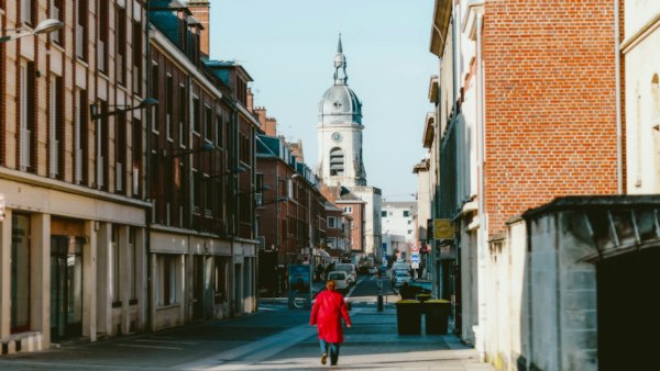 A street towards a belfry — Amiens, France