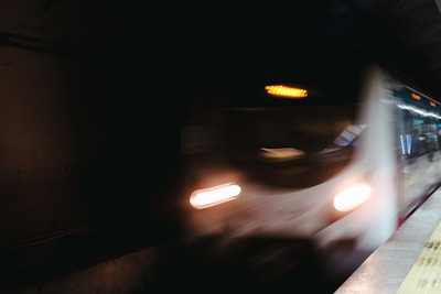 A blurry photo of a subway train at night