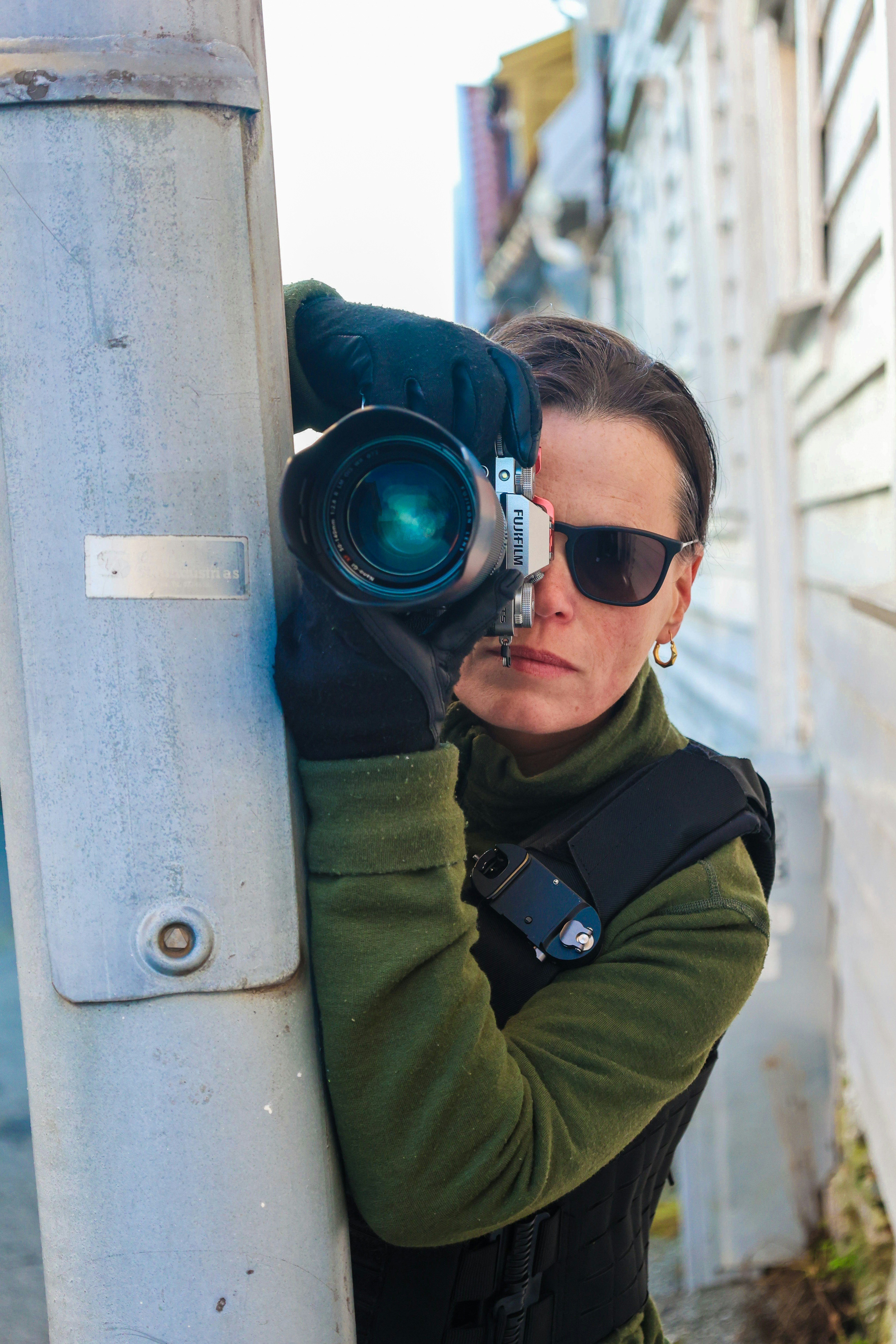 A woman with a camera on a pole