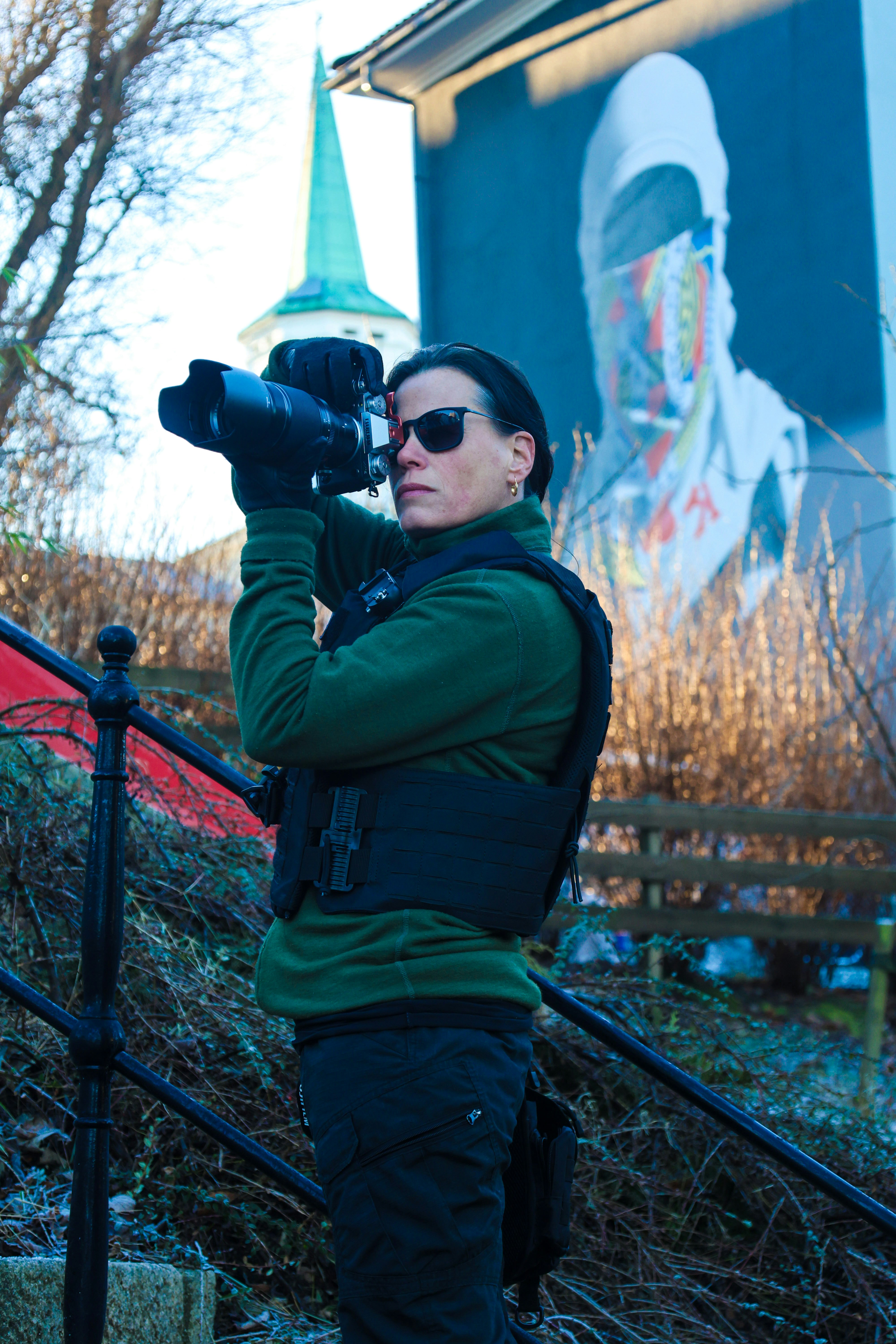 A woman taking a picture with a camera
