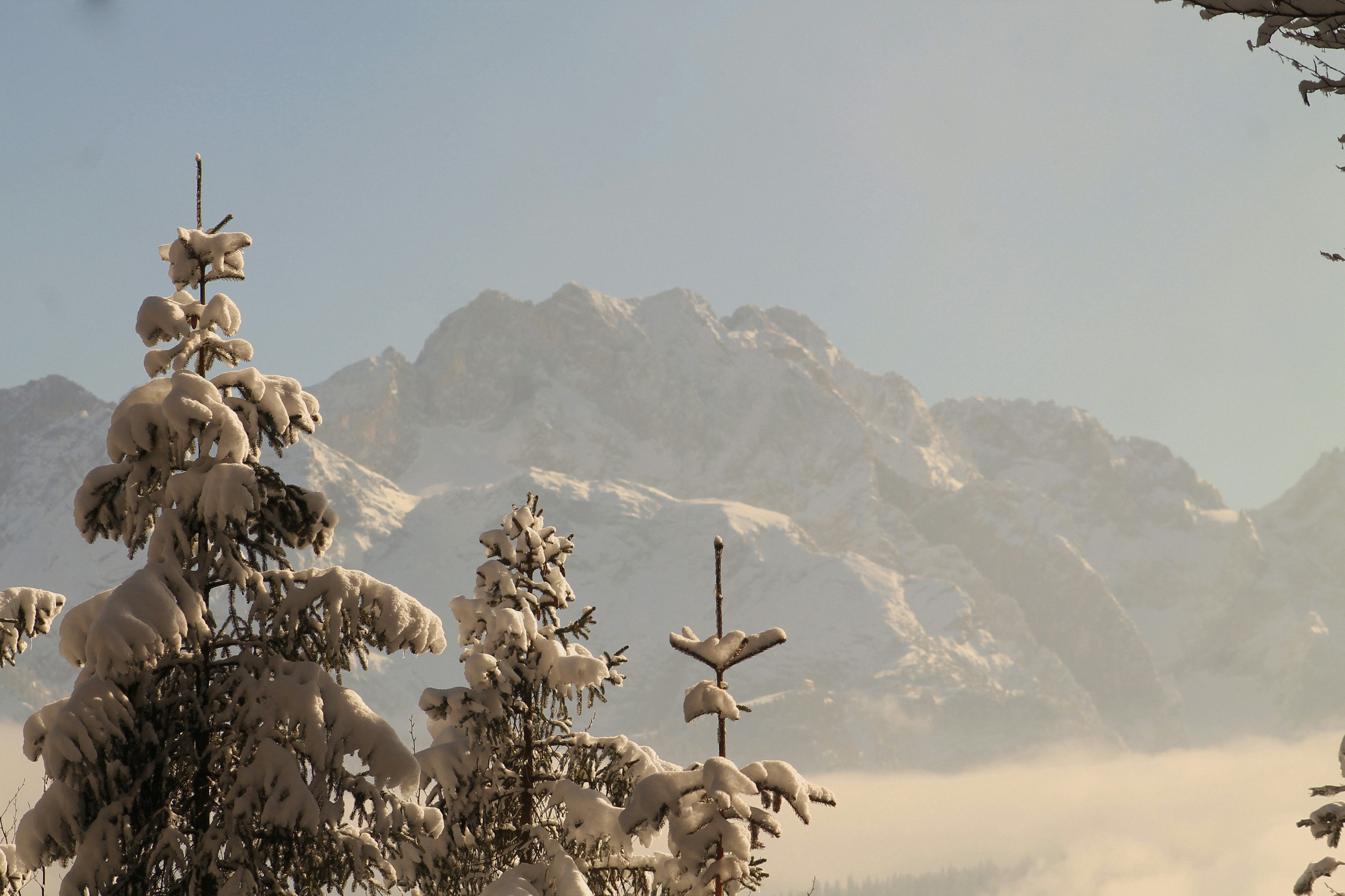 A view of a snowy mountain range from a balcony