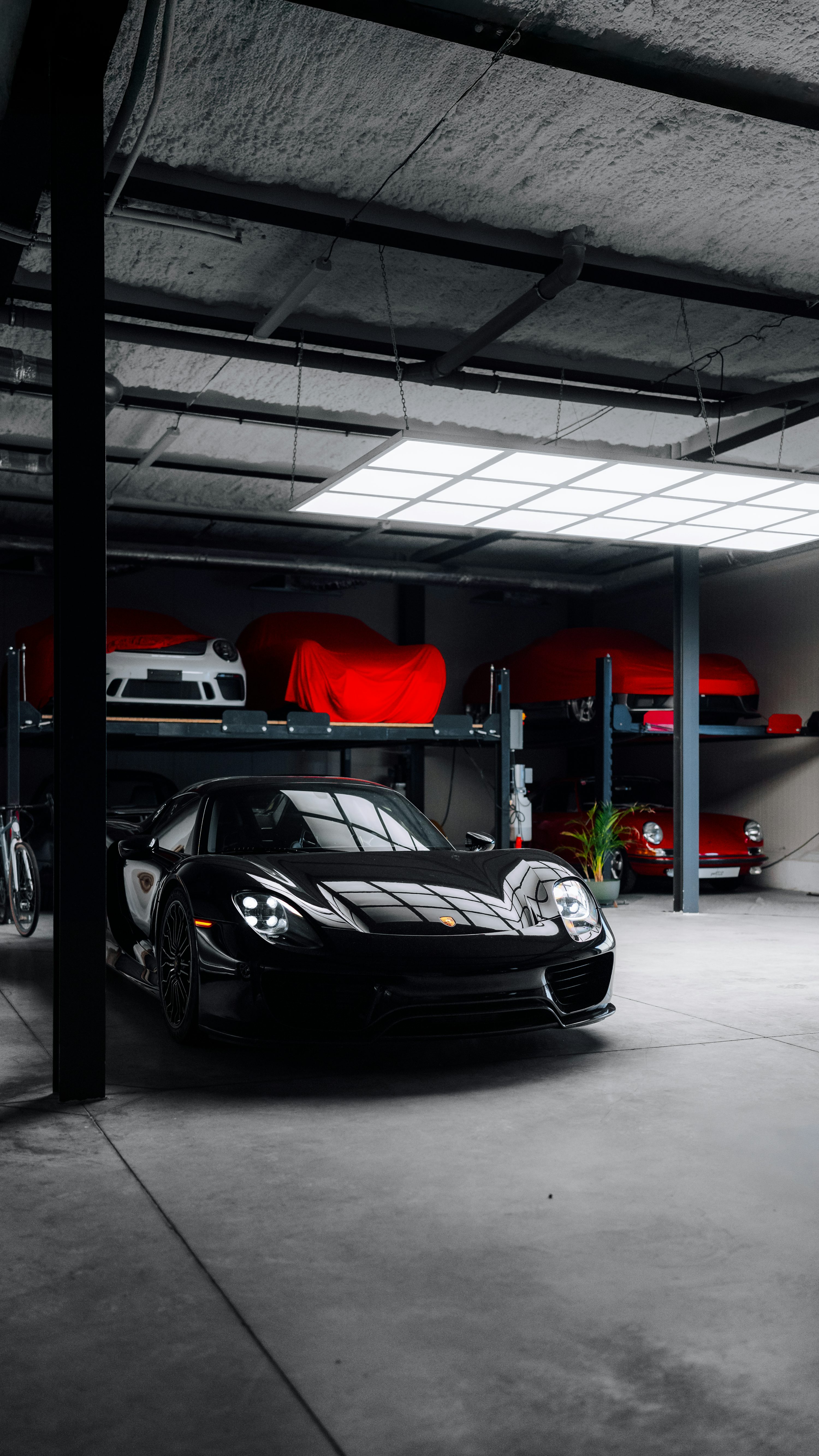 A black sports car parked in a garage