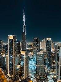 A view of a city at night from the top of a building
