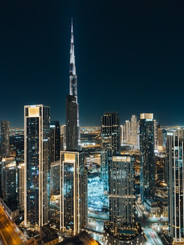 A view of a city at night from the top of a building