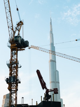 A crane that is standing next to a building