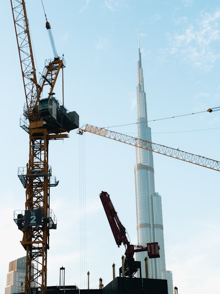 A crane that is standing next to a building