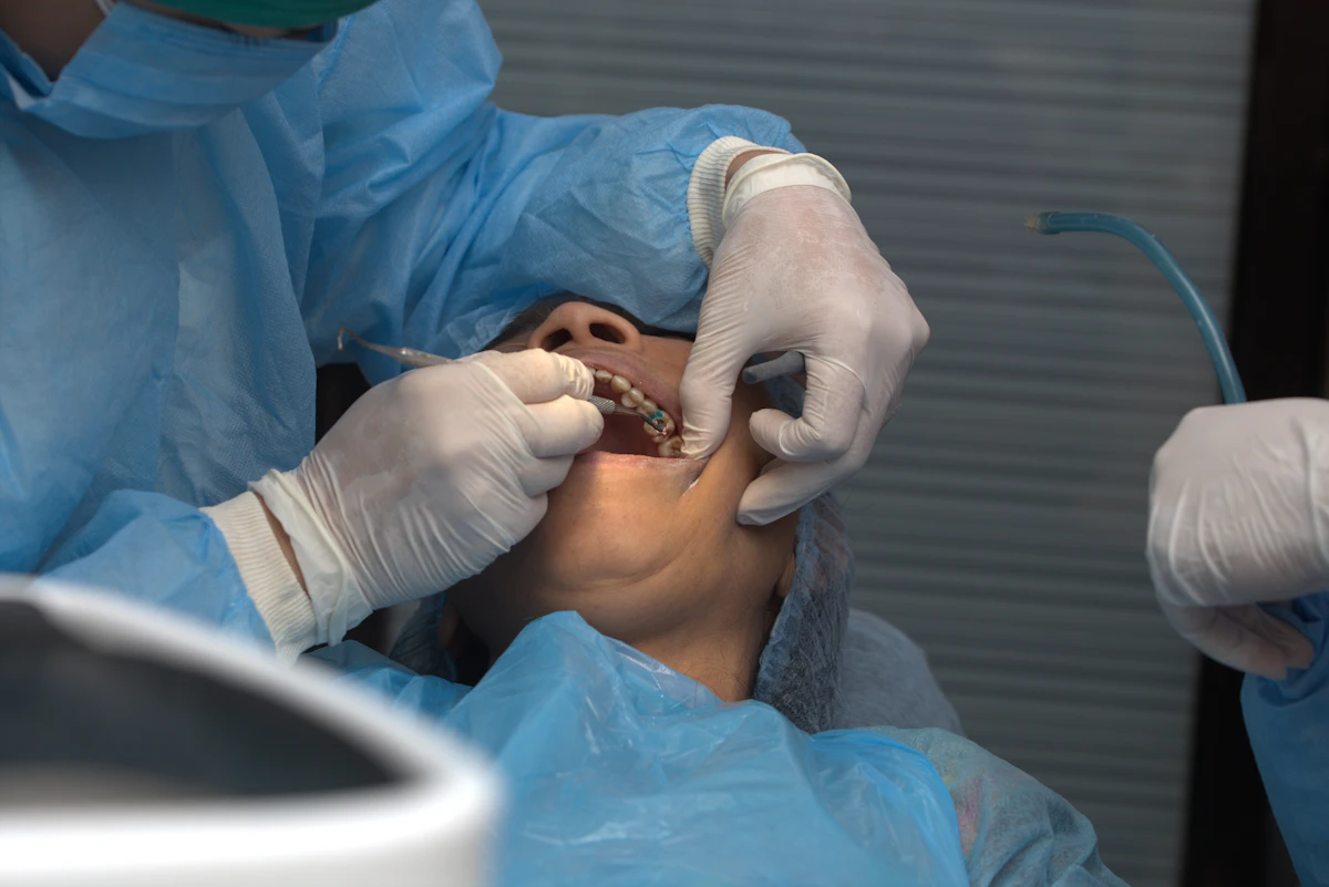 İllüstratif görsel: A man getting his teeth checked by a dentist