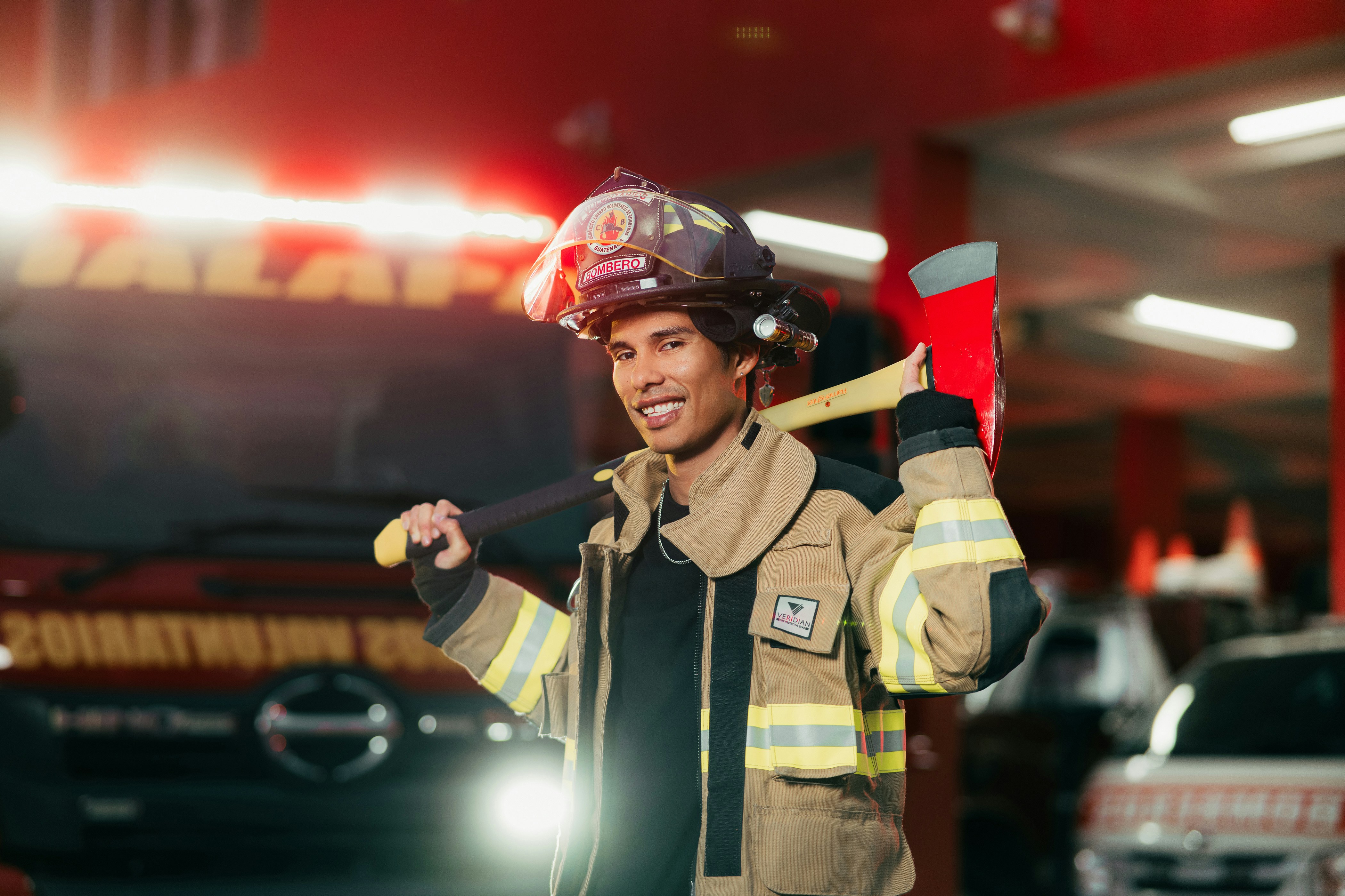A firefighter standing in front of a fire truck