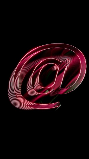 A red email symbol on a black background