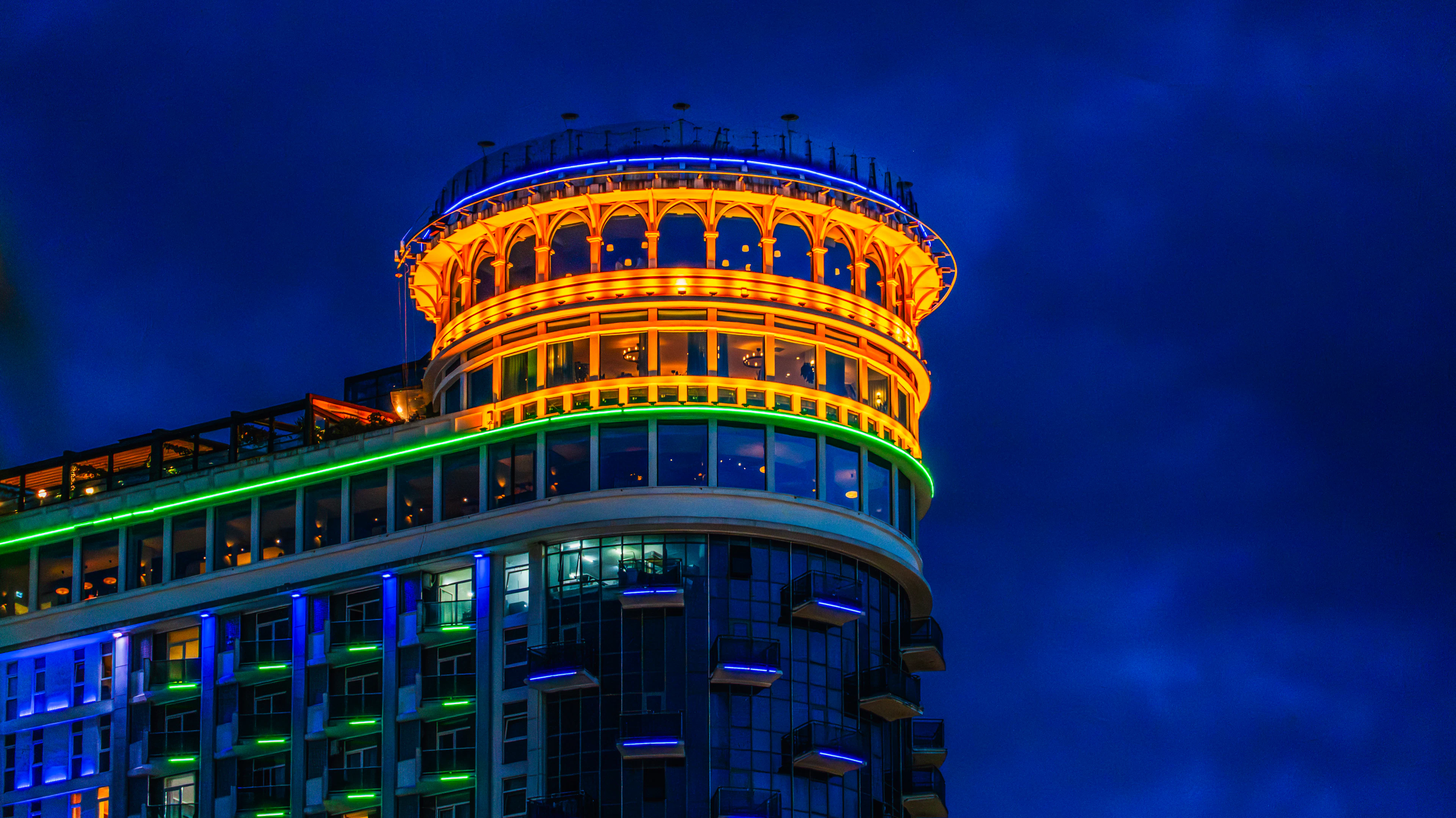 Batumi seafront tower glowing at night