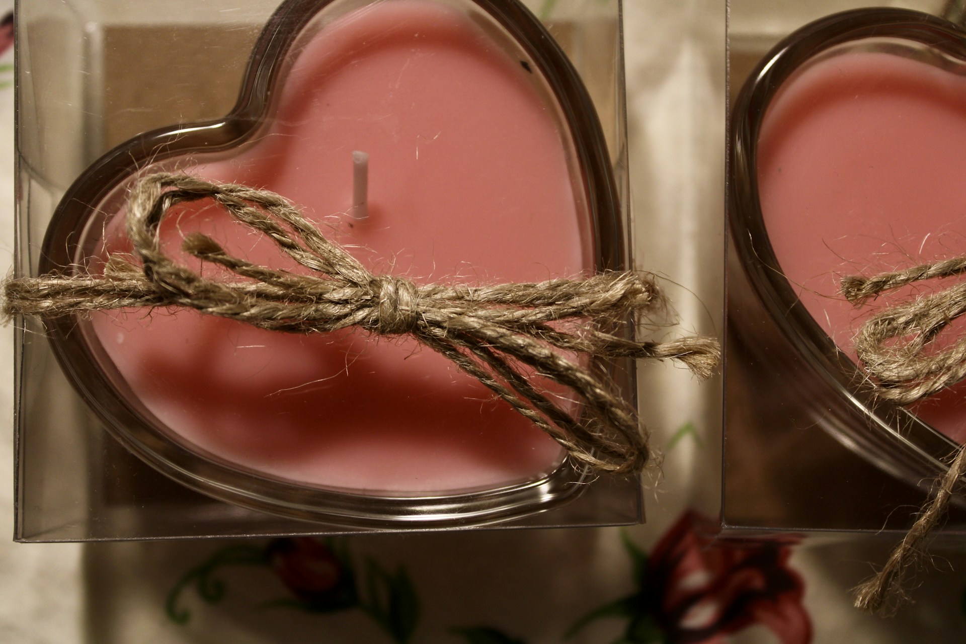 A couple of heart shaped candles in a box