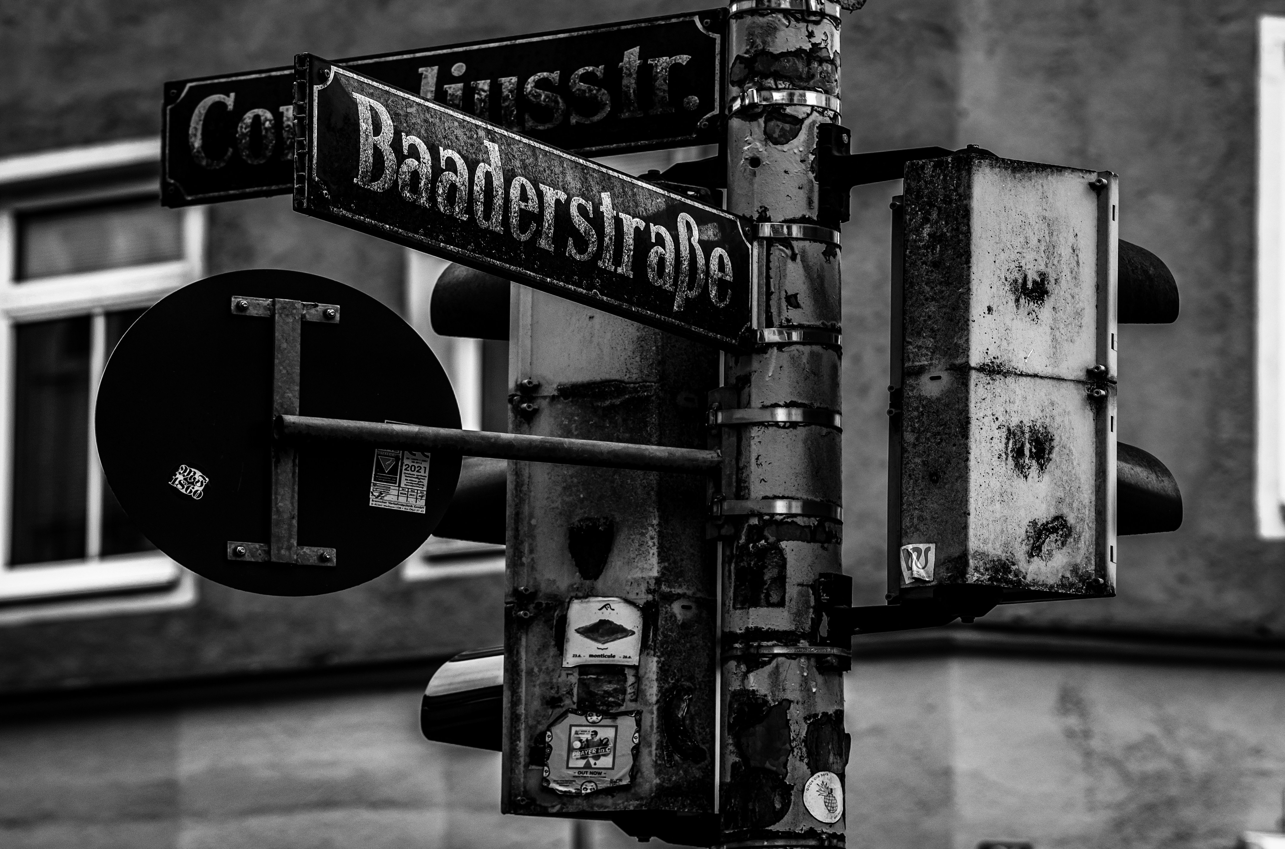 A black and white photo of a street sign