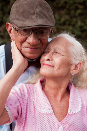 A man and a woman are posing for a picture