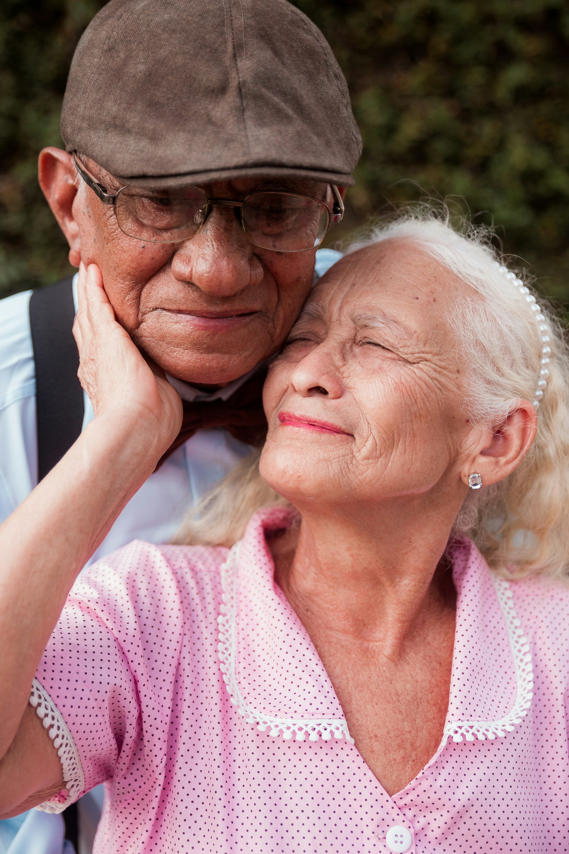 A man and a woman are posing for a picture
