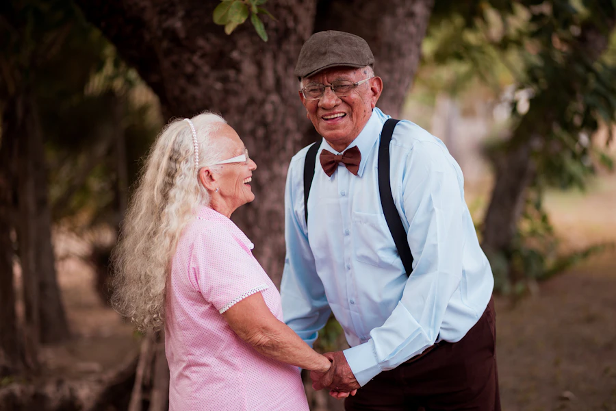 Older couple outdoors together under a tree