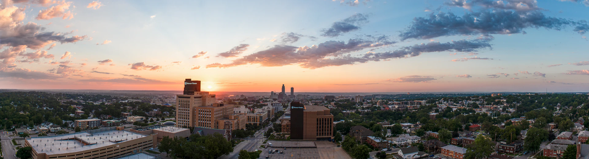 A view of a city at sunset from a bird's eye view