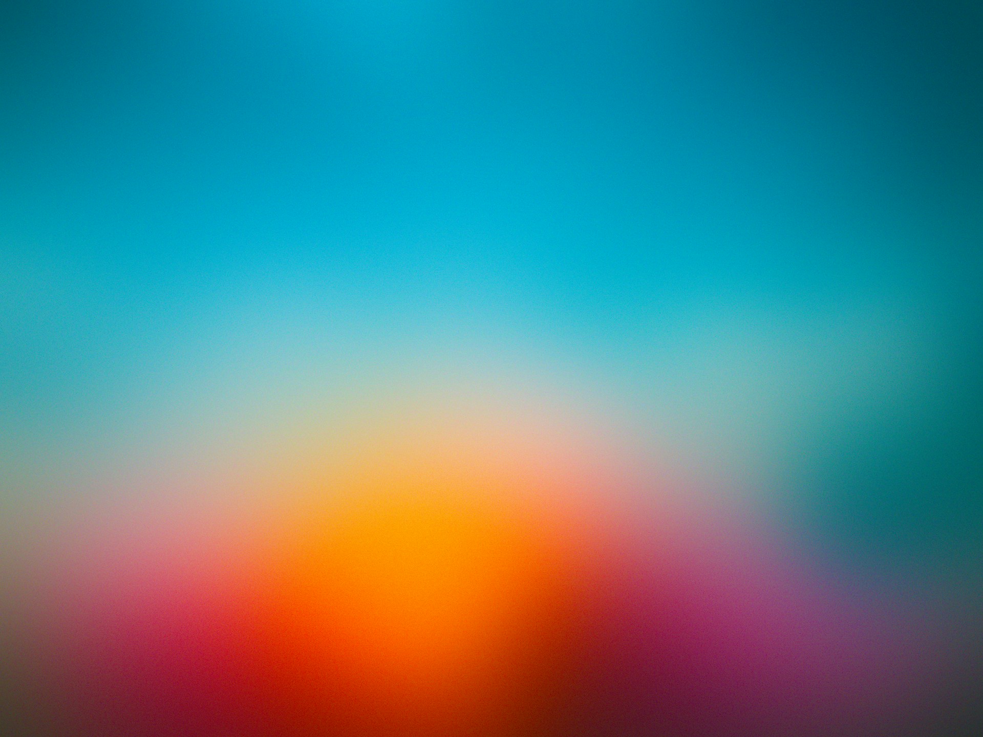 A blurry image of a blue and orange background