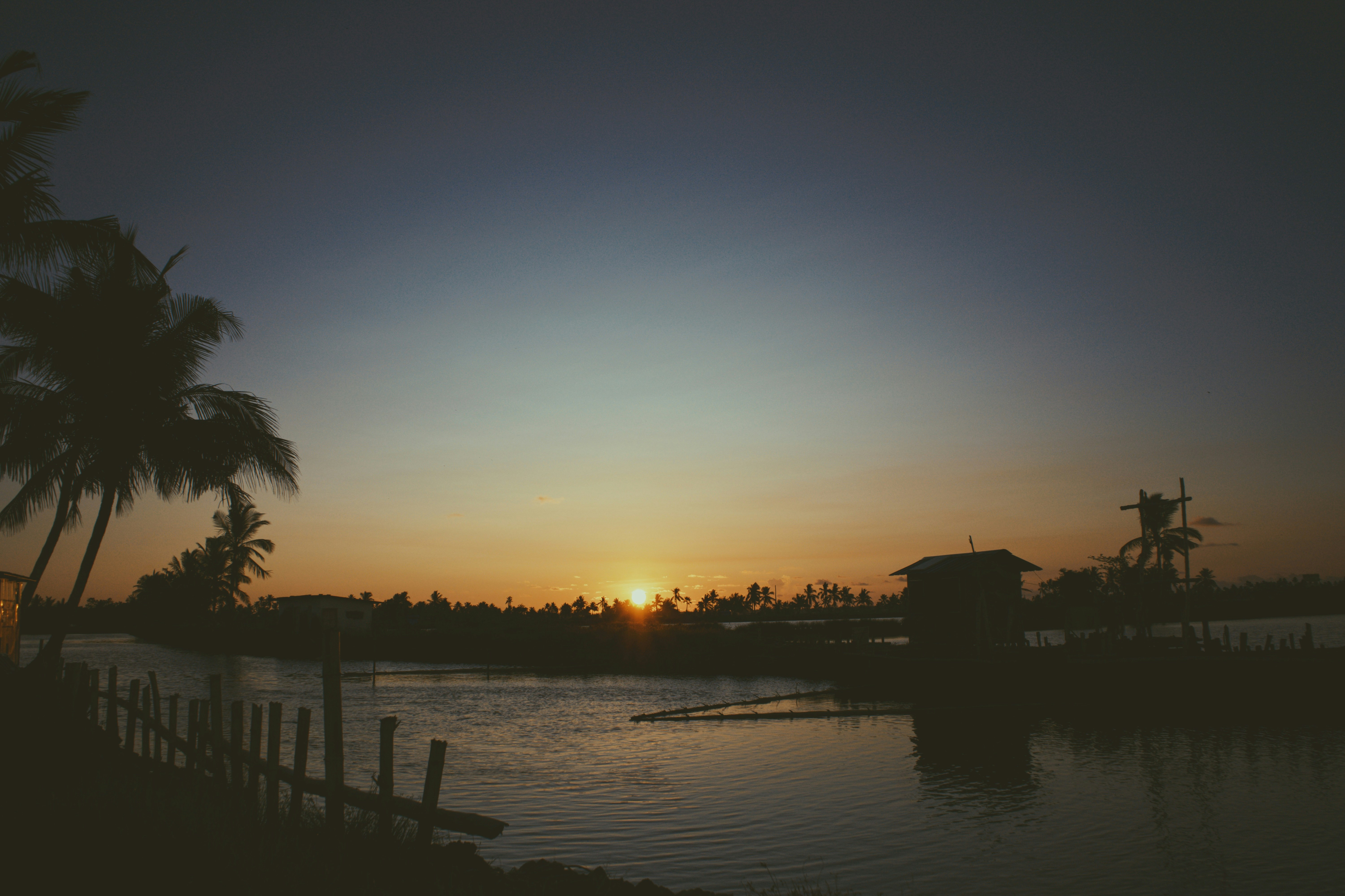 The sun is setting over a body of water