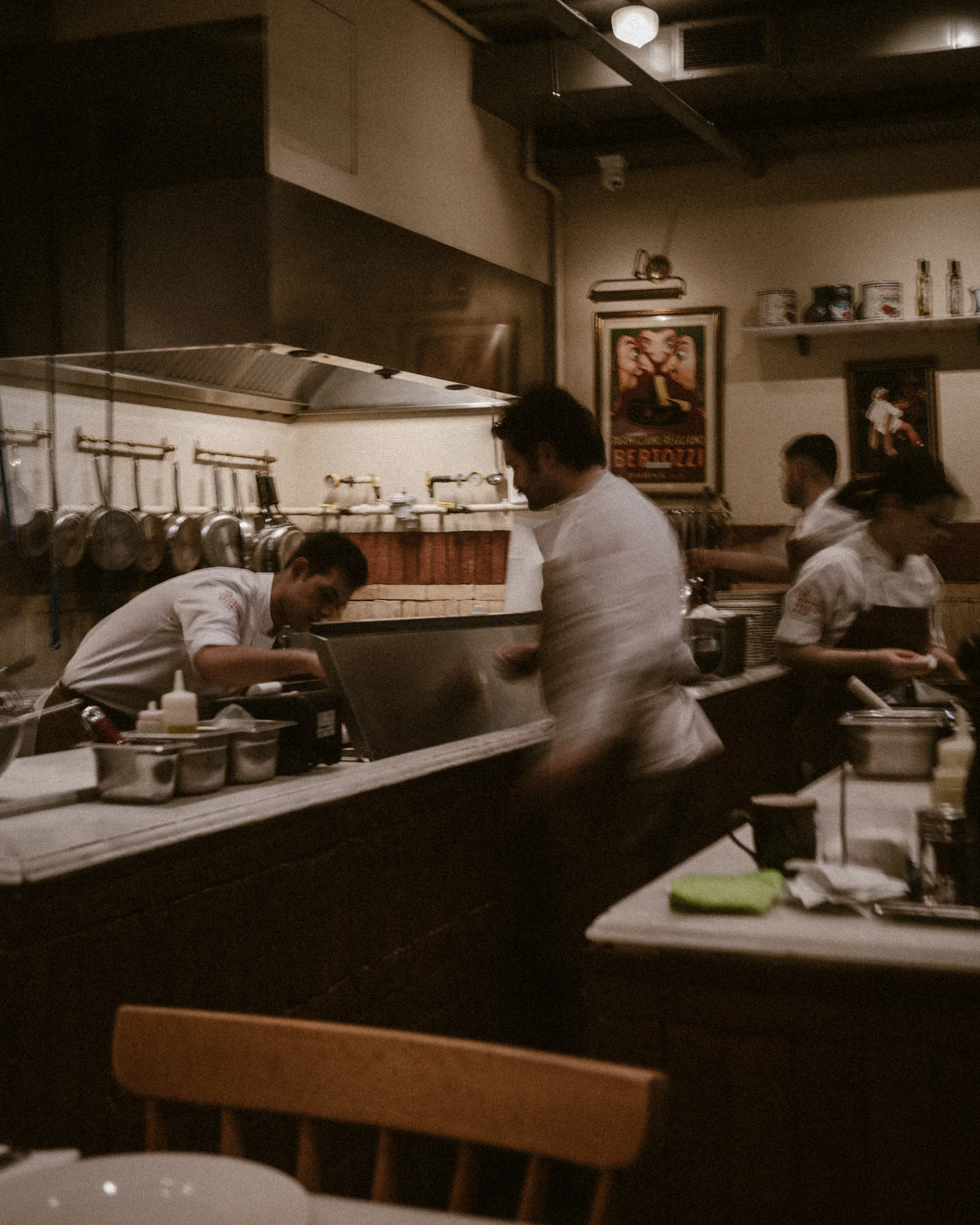 A kitchen team preparing food during service