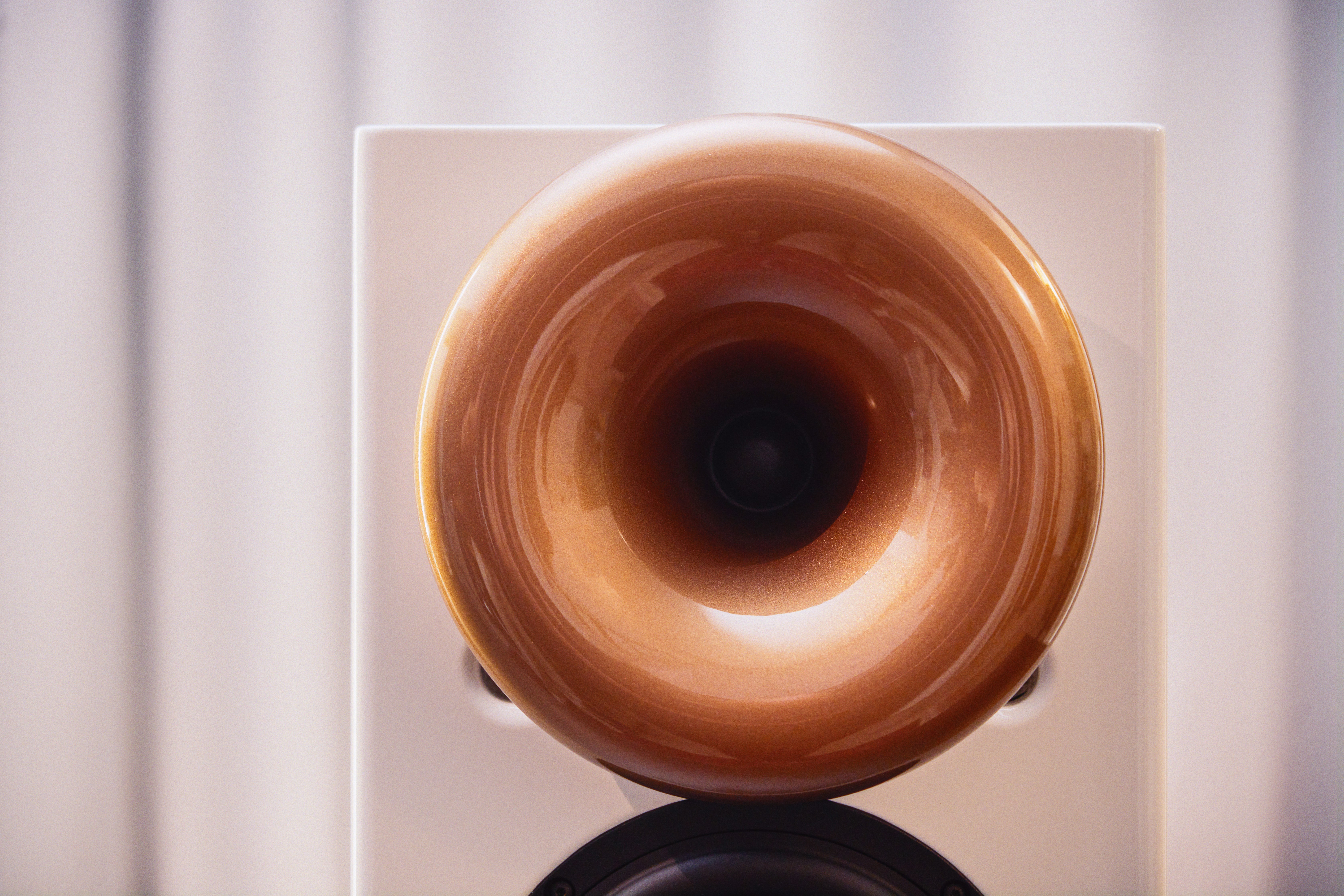 A large brown donut sitting on top of a white box
