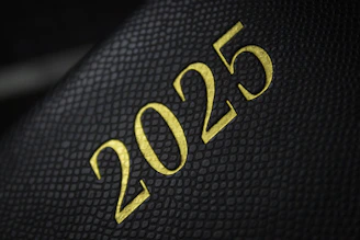 A close up of a black and gold cover of a book