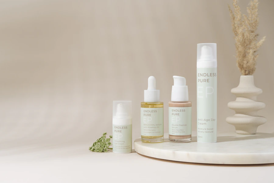 A white table with a bunch of bottles and a plant