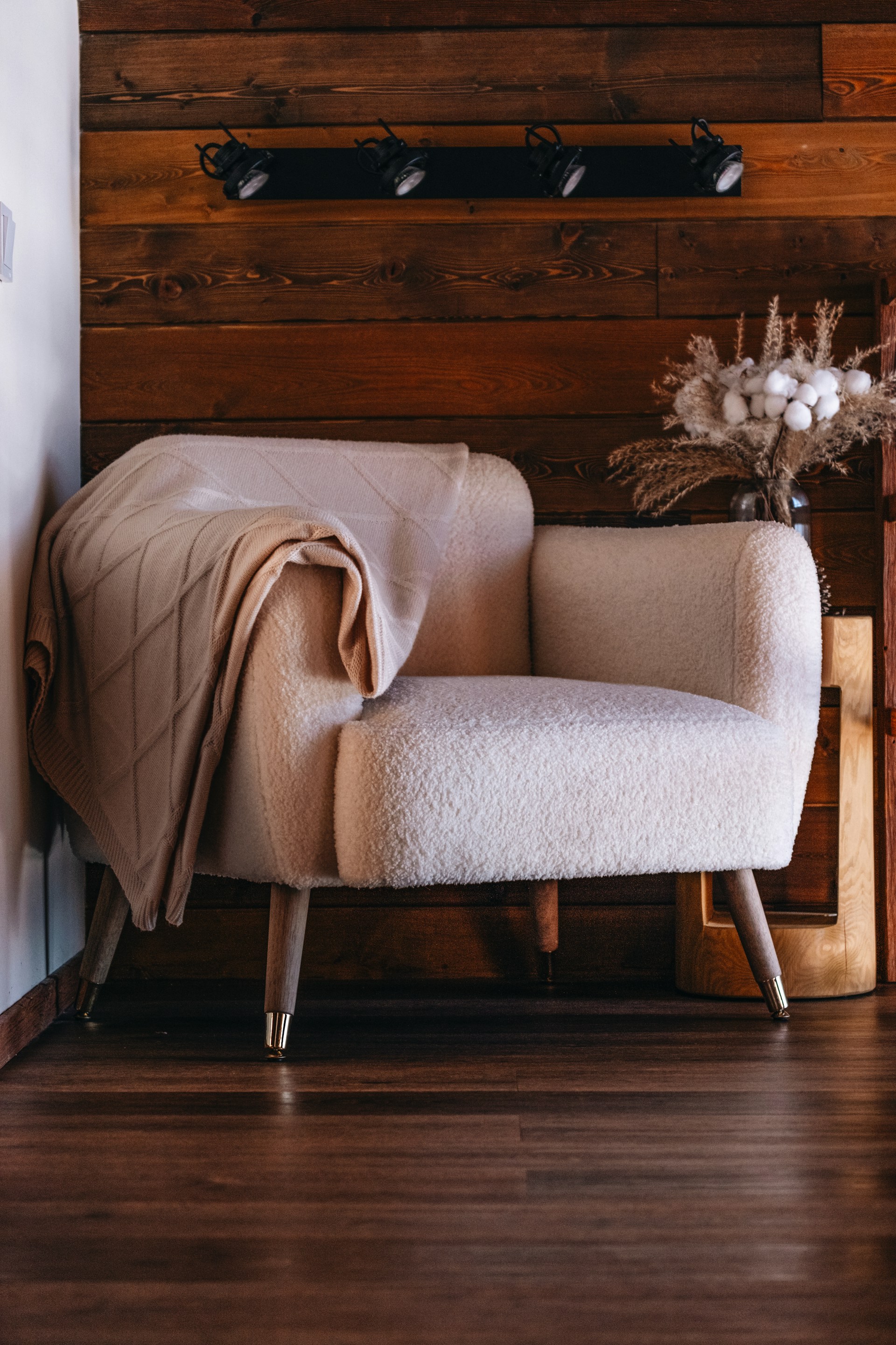 A chair with a blanket on top of it