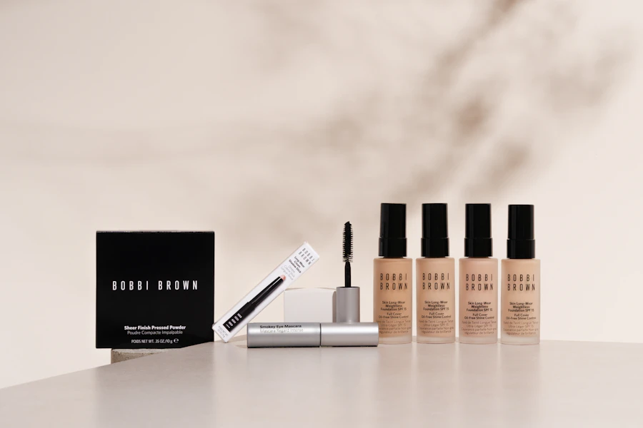 A white table topped with three bottles of makeup