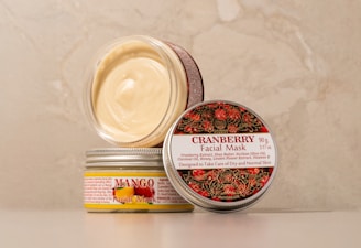 A jar of cream sitting on top of a table