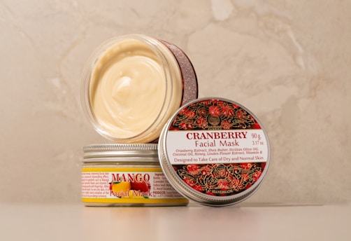 A jar of cream sitting on top of a table