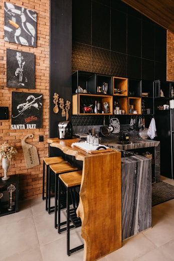 Stylish cafe interior with natural elements—warm wood, cool marble, and black metal—creating cozy Sg