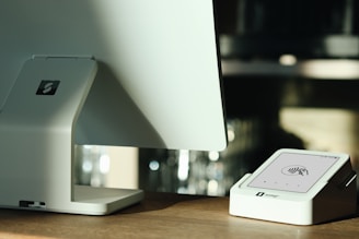 A computer monitor sitting on top of a wooden desk