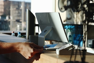 A man is sitting at a desk with a computer