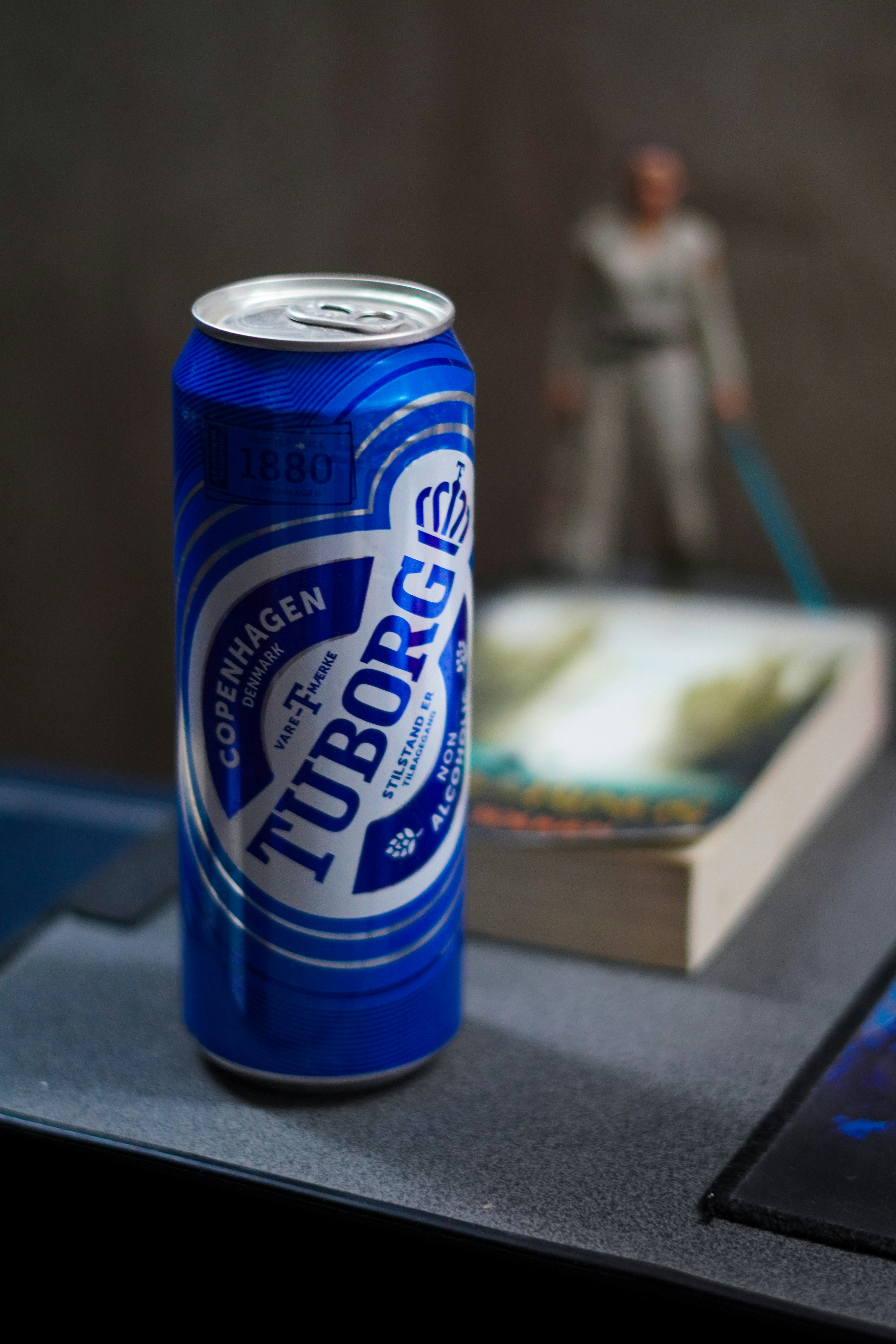A can of beer sitting on top of a table