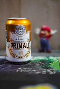 A can of beer sitting on top of a table