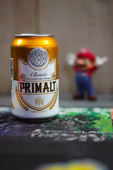 A can of beer sitting on top of a table