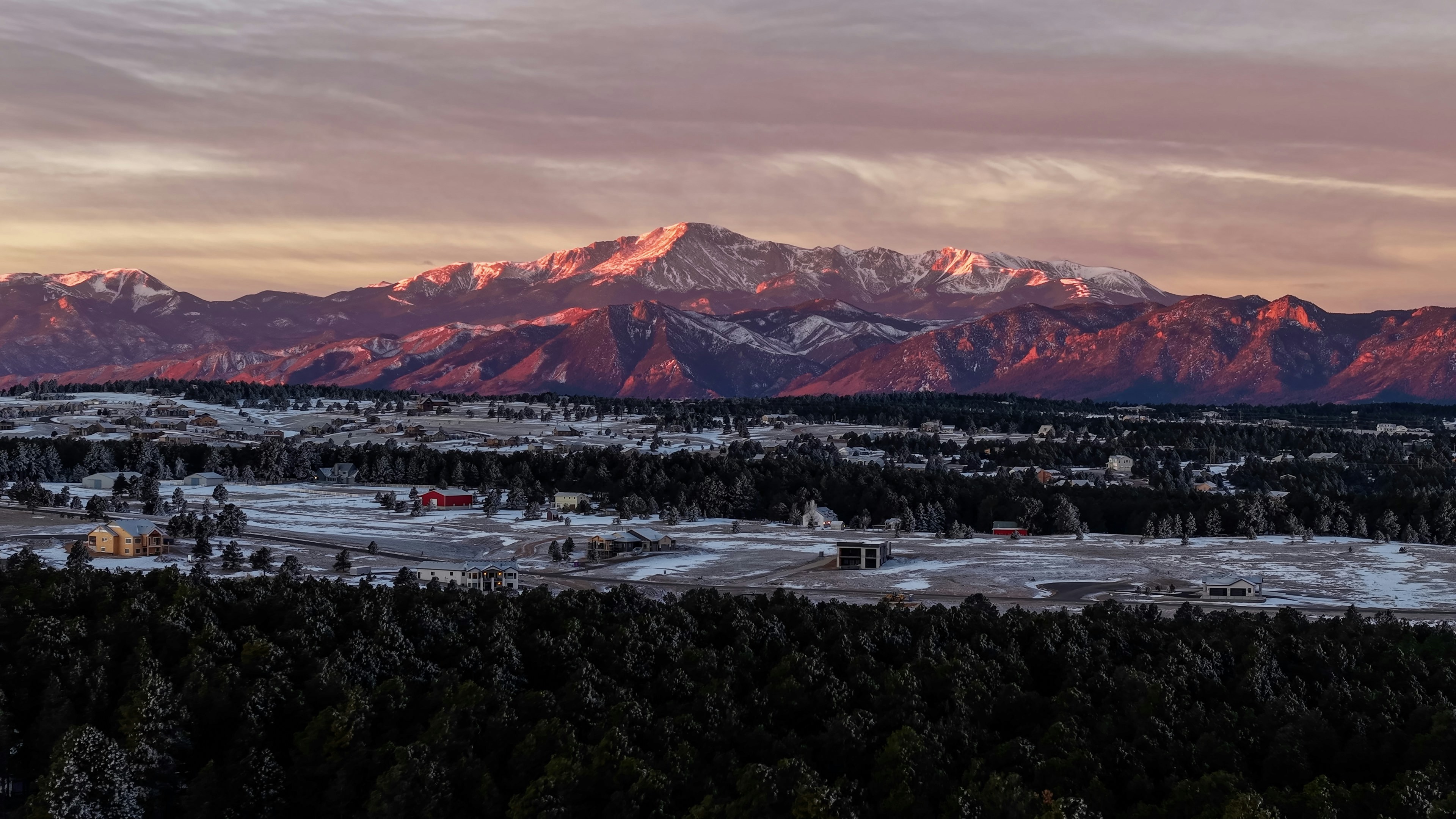 A view of a mountain range at sunset