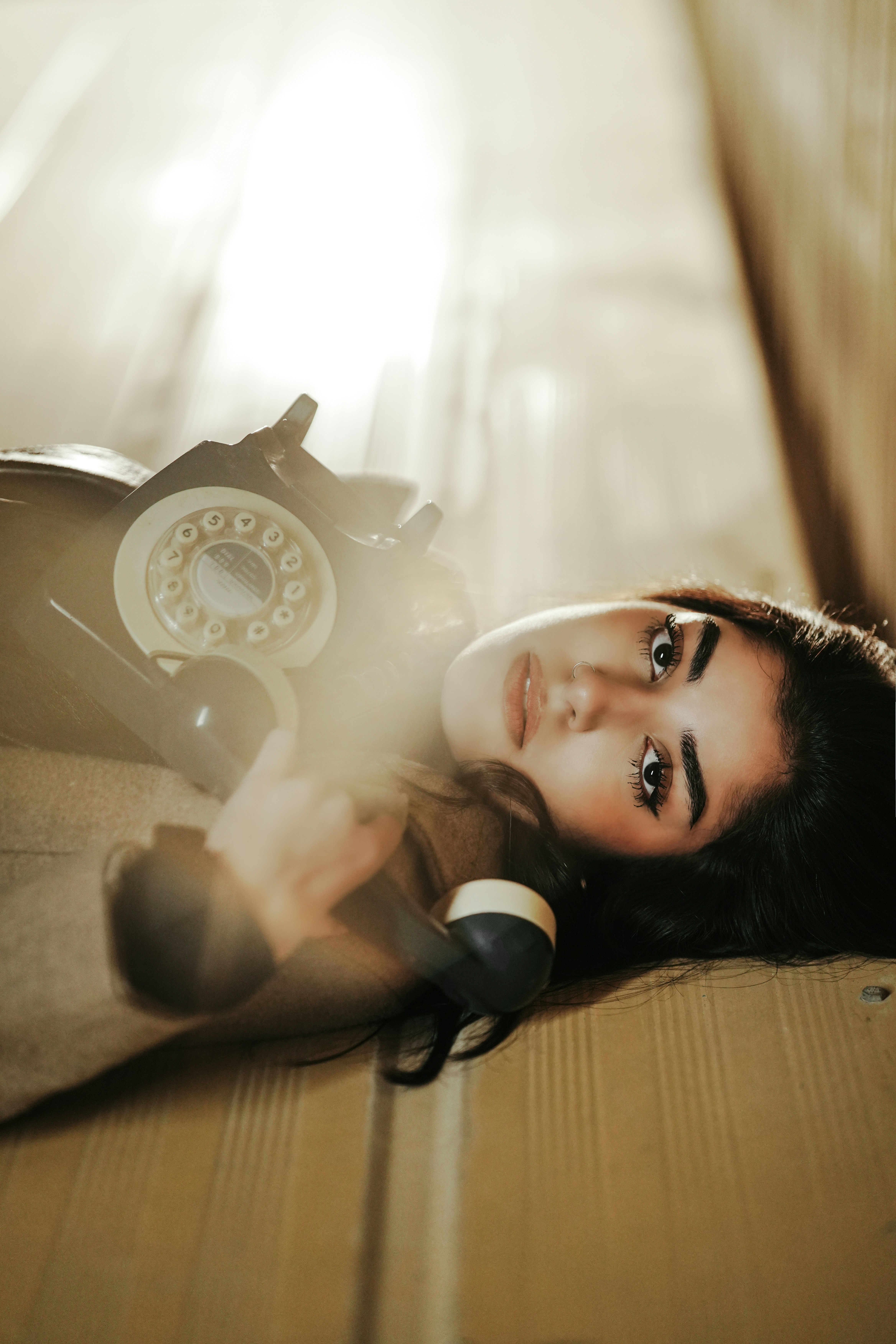 Screenshot of the 'Prelovedd' website waitlist page showing a woman next to a vintage rotary phone.