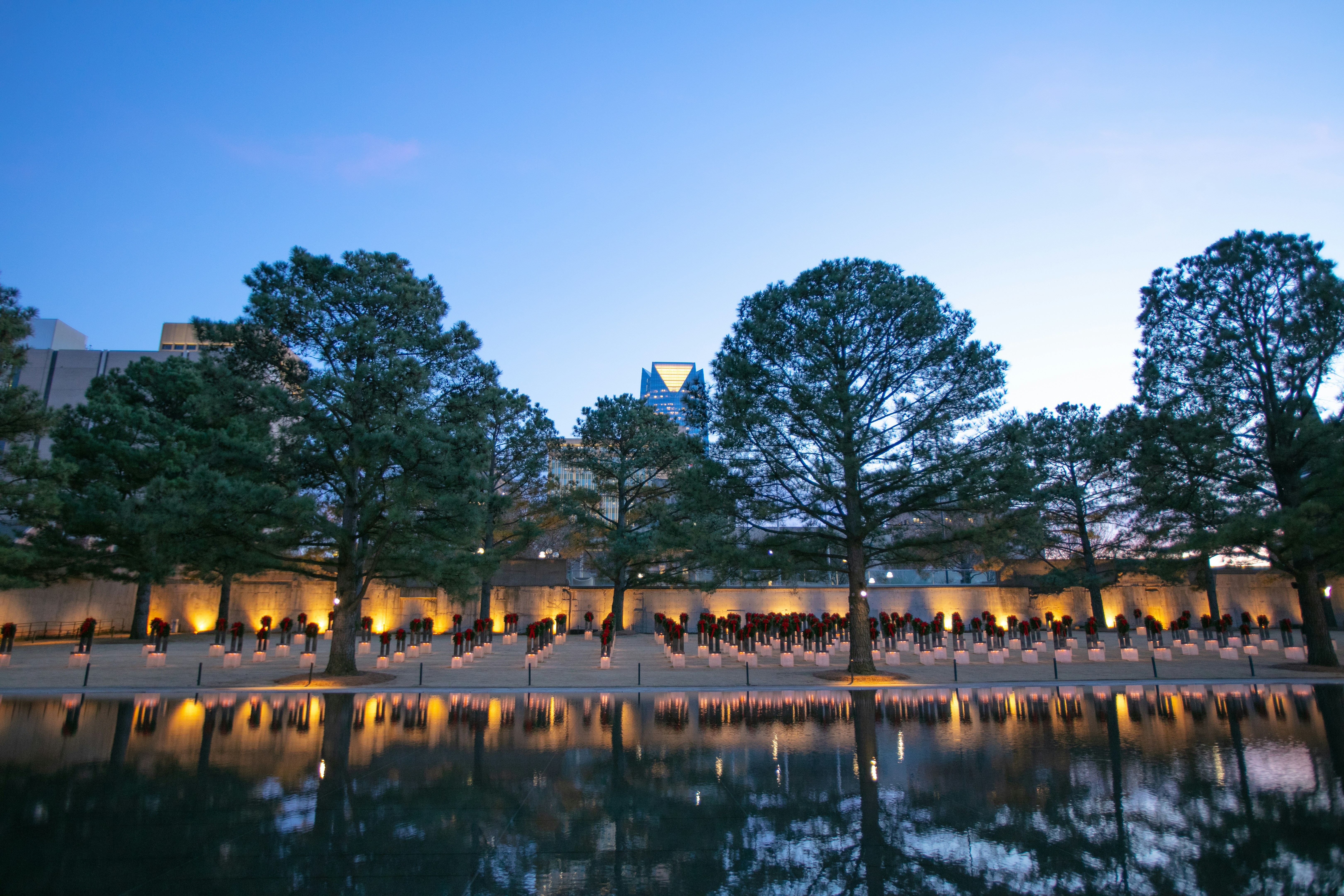Outdoor event venue near Oklahoma City, OK surrounded by trees and open water