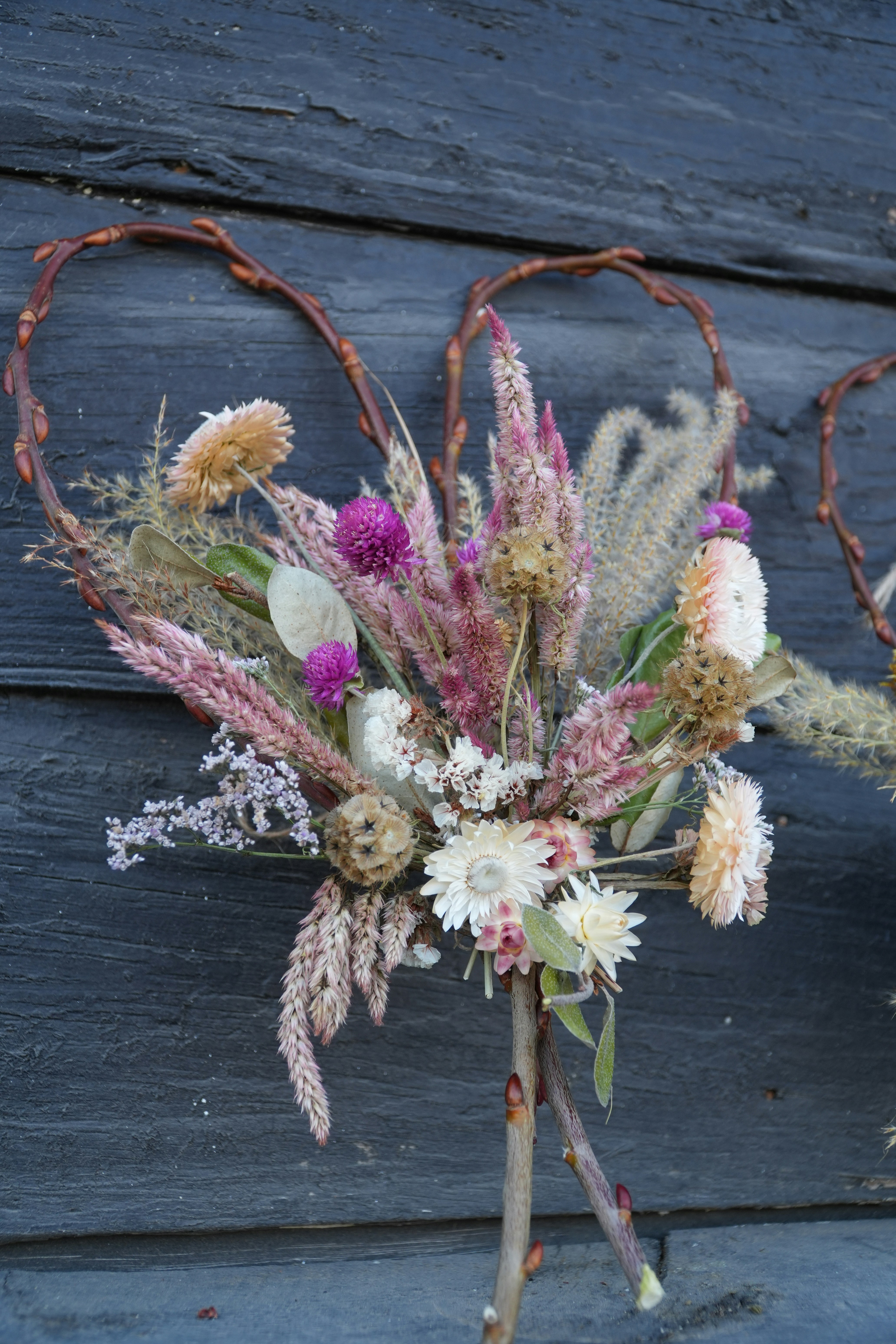 A bouquet of flowers sitting on top of a wooden table