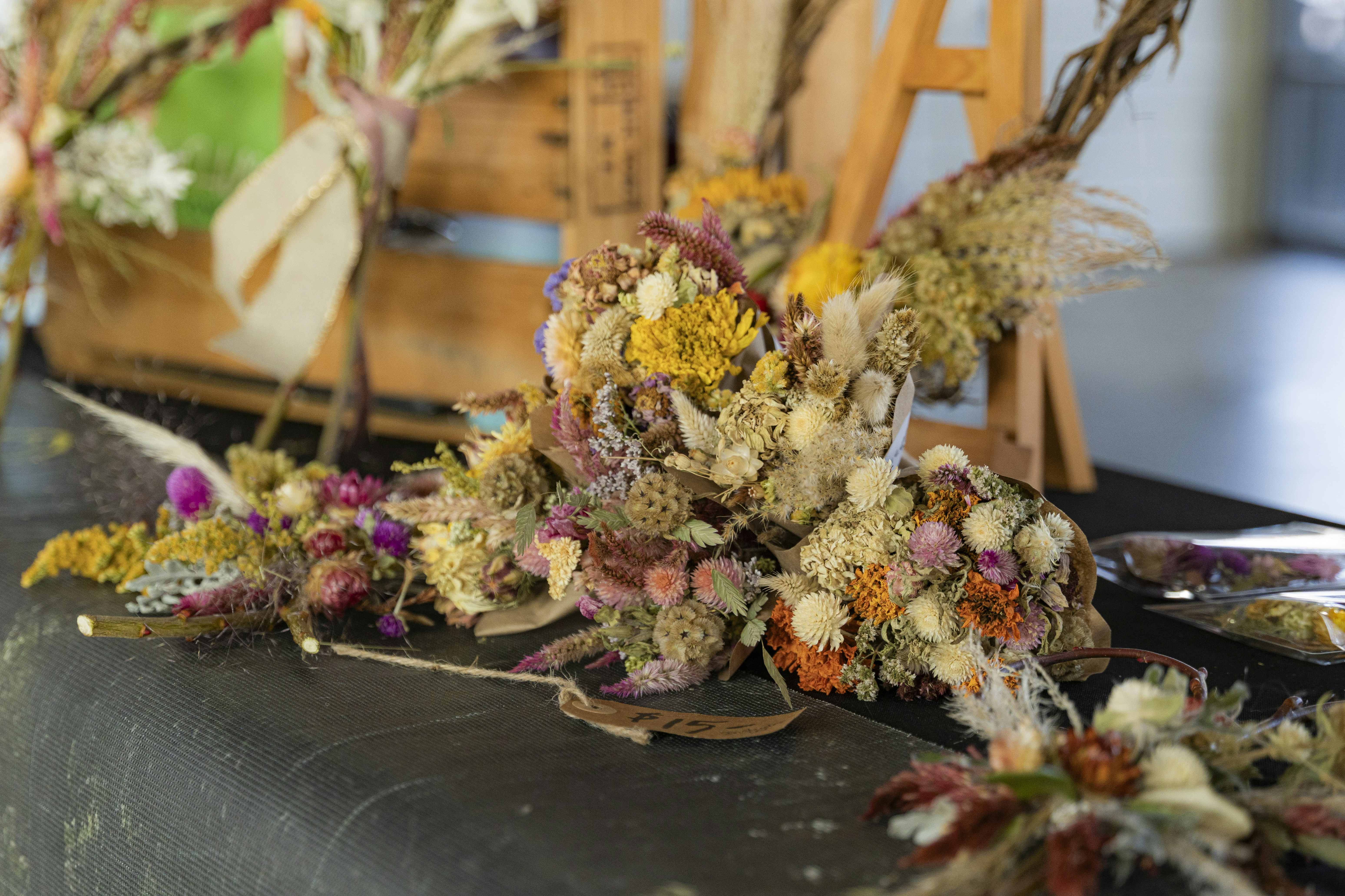 A bunch of dried flowers sitting on top of a table
