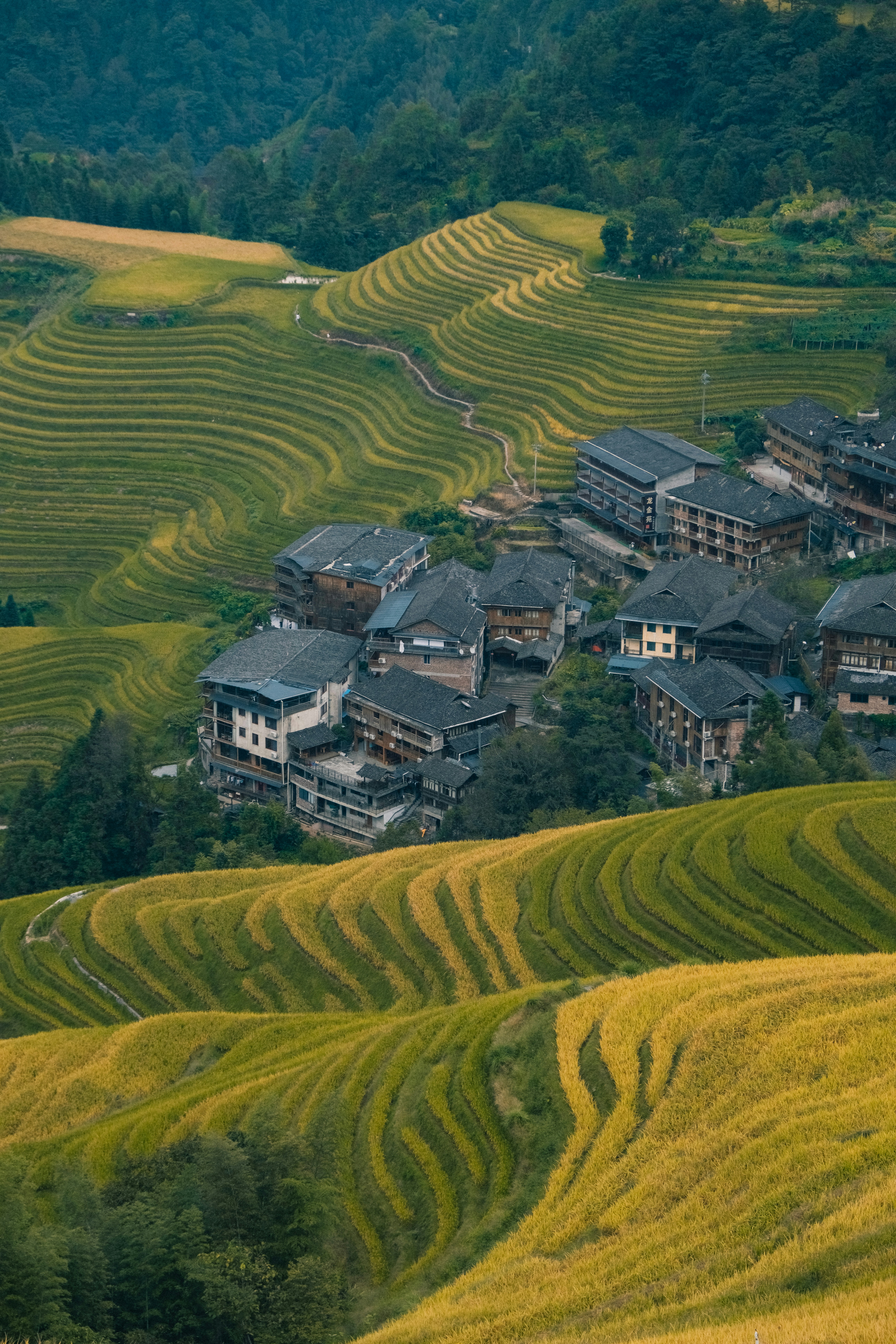 An aerial view of a village in the mountains photo – Free Building ...