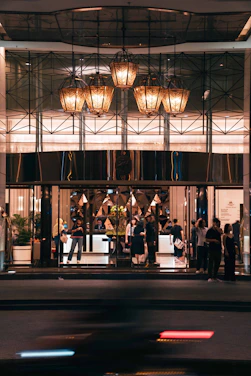 A group of people standing outside of a building