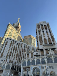 A very tall building with a clock on it's side